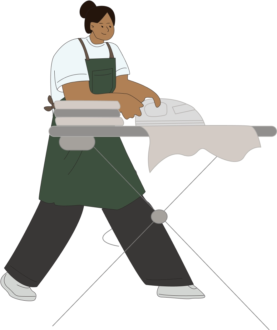 Polly Housekeeping professional in white shirt and signature green apron carefully ironing clothes