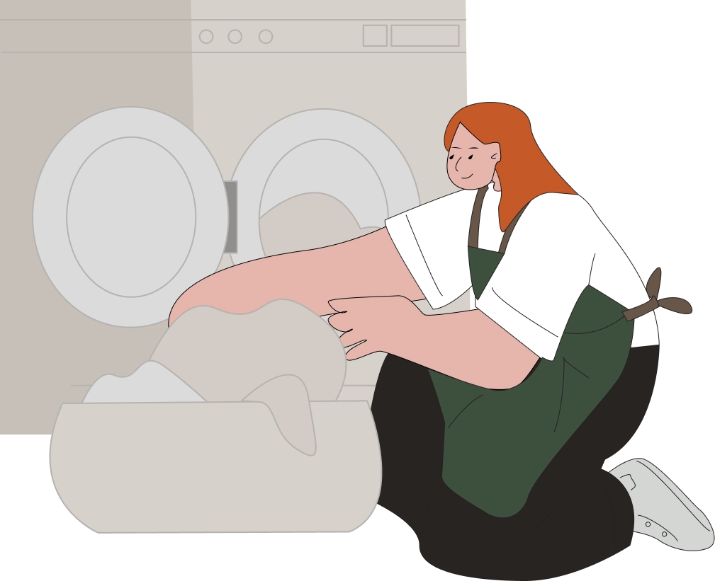 Polly Housekeeping professional in white shirt and signature green apron sorting and loading laundry into a washing machine